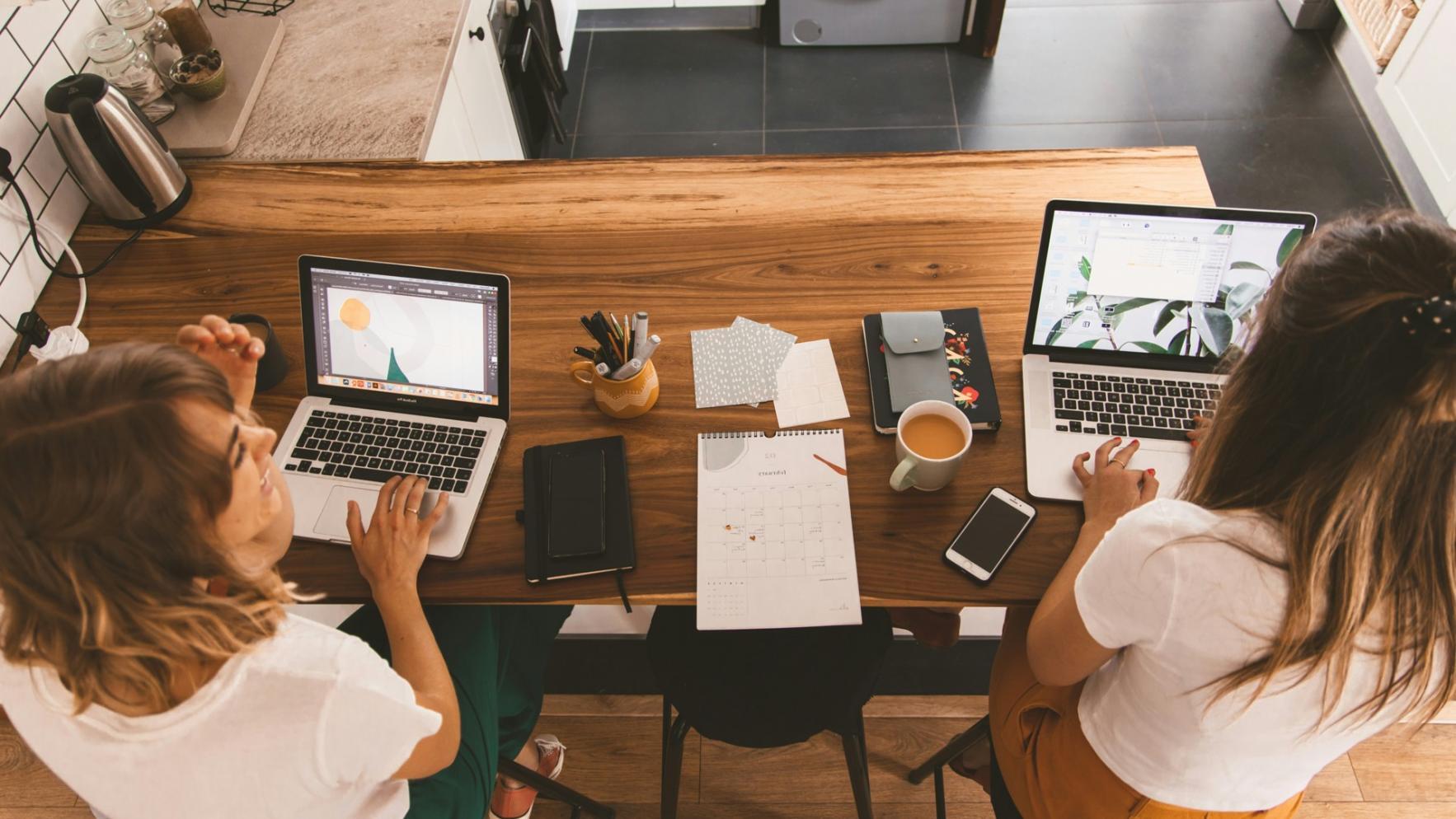 Person reviewing budget documents at workspace